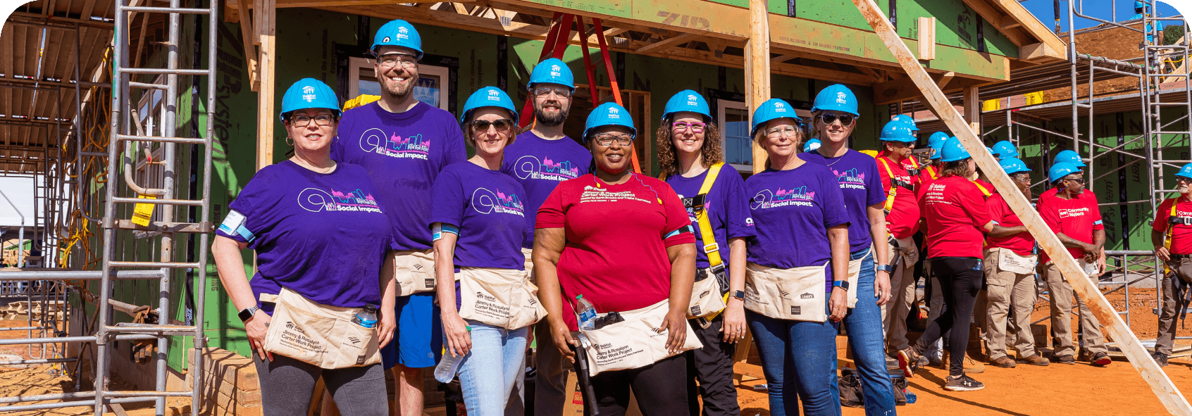 A group of Ally employees volunteering at a Habitat for Humanity work site.