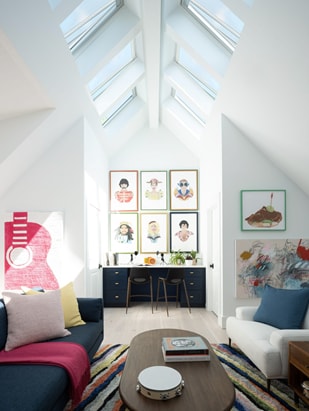 HGTV’s Brian Patrick Flynn designed a sitting room with a music theme. Light enters the room through skylights.