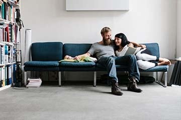 young couple relaxing with their newborn baby