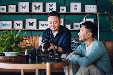A father and son work together on their photography