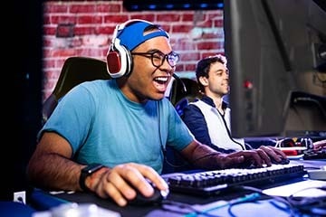 an excited gamer on a computer