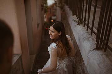 Bride walking though alley in Positano, Italy