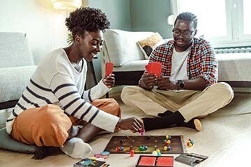Image of a couple playing a board game