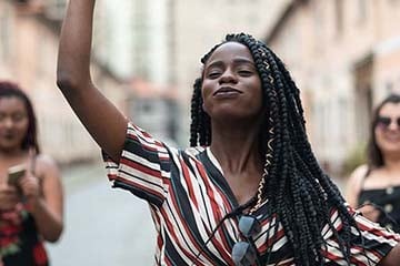 Group of diverse friends dancing at street