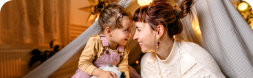 A parent and child playing.
